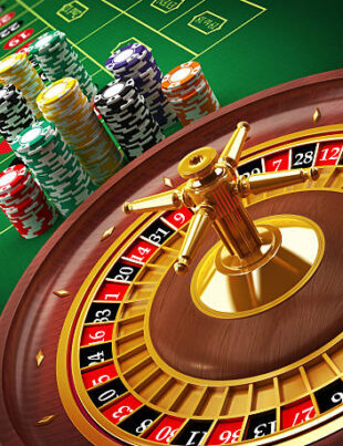 Roulette wheel and casino chips on the table.Similar images: