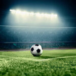 View of soccer ball on athletic field in stadium arena